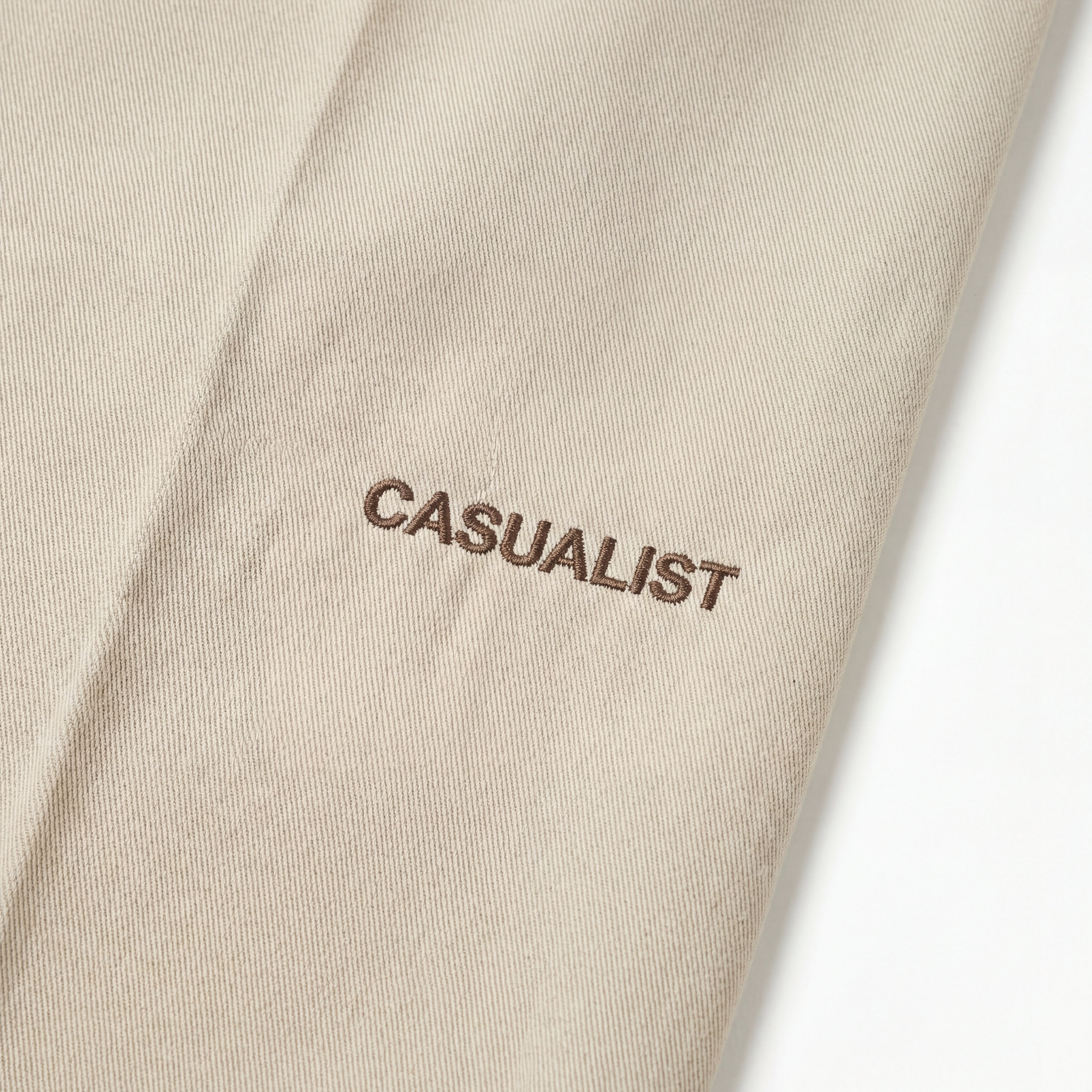 Casualist pleated trousers on course lifestyle shot