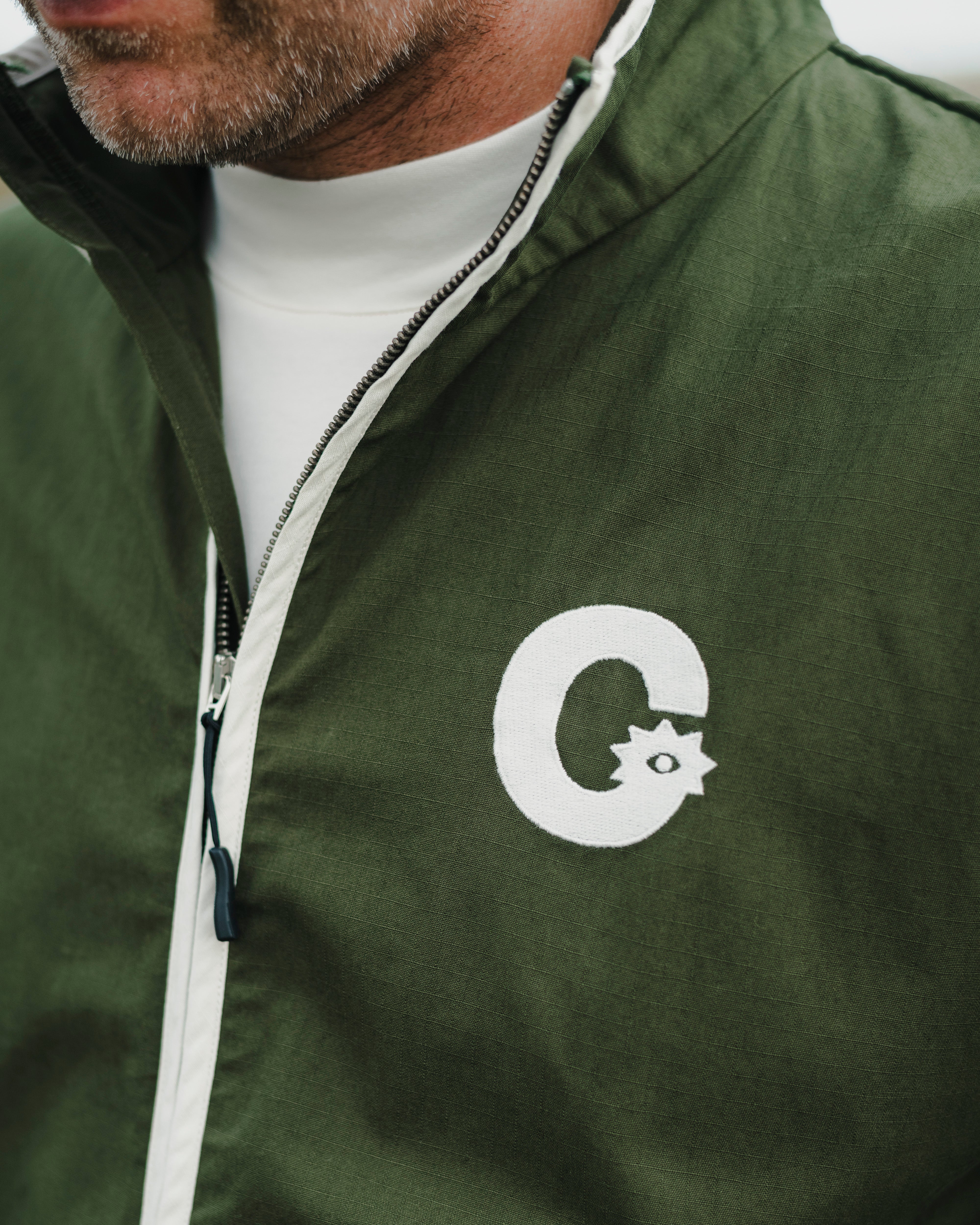 Casualist Cart Path Ripstop Jacket detail logo close up